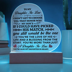 Illuminated acrylic heart plaque with sentimental message for daughter-in-law, displayed on a wooden base, perfect as a heartfelt gift for special occasions.