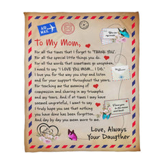 Coral fleece blanket with a heartfelt printed letter expressing love and gratitude from a daughter to her mom, decorated with butterflies and airmail-themed accents.