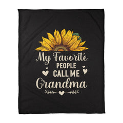 Black coral fleece blanket featuring a bright sunflower and the phrase "My Favorite People Call Me Grandma" in cream lettering, a heartfelt gift for grandma.
