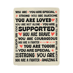 Cozy fleece blanket featuring uplifting and encouraging phrases like "You are loved," "You are brave," and "You are supported," designed as a heartfelt gift for daughters.