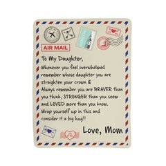 Beige sherpa fleece blanket designed like an airmail envelope with heartfelt message from mom to daughter, encouraging strength, love, and comfort.