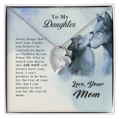 Old Wolf - Forever Love Necklace displayed in a gift box with a heartfelt message to a daughter, featuring a heart-shaped pendant with a sparkling stone and an illustration of two wolves.