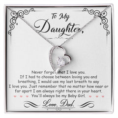 Heart-shaped silver necklace with a sparkling crystal on a chain, presented on a card with a loving message from a father to his daughter, perfect for heartfelt gift giving.