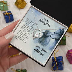 Old Wolf - Forever Love Necklace featuring a heart-shaped pendant with a clear stone, displayed in a gift box with a loving message from mom to daughter and wolf illustrations.