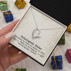 Necklace Unbiological Sister Forever Love: silver heart pendant with a central crystal on a delicate chain in a box