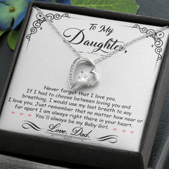 Silver heart-shaped necklace with a sparkling crystal pendant displayed on an engraved message card expressing a father's love for his daughter, presented in a gift box.