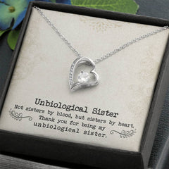 Necklace Unbiological Sister Forever Love, silver-tone heart pendant with a central crystal and crystal-accented edge.