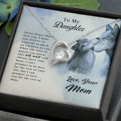 Silver heart-shaped pendant necklace with a small gemstone, presented in a gift box featuring a heartfelt message to a daughter and an illustration of two wolves, Old Wolf - Forever Love Necklace.