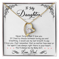 Heart-shaped gold necklace with a sparkling crystal pendant, displayed on a sentimental card expressing a father's love to his daughter, perfect for a heartfelt gift.