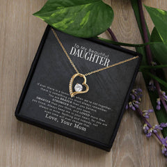 My Beautiful Daughter Forever Love Necklace, gold heart pendant with a crystal accent on a gold chain.