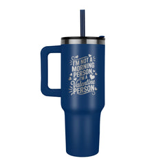 Blue stainless steel tumbler with a handle and straw, featuring a laser engraved humorous message about not being a morning person but a Valentine person.