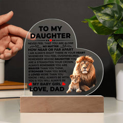 Heart-shaped acrylic plaque with an inspirational message from a father to his daughter, featuring a detailed illustration of a lion and cub, displayed on a wooden base.