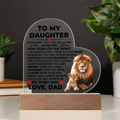 Heart-shaped acrylic plaque with a touching message from a father to his daughter, featuring a lion and cub illustration, displayed on a wooden base for home décor.