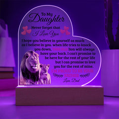 Heart-shaped LED acrylic plaque glowing purple with a heartfelt message from a father to his daughter, featuring images of a lion and cub on a wooden base.