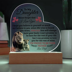 Heart-shaped acrylic plaque with a heartfelt message from a father to his daughter, featuring an image of a lion and cub, displayed on a wooden base with LED lighting.