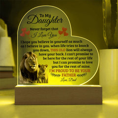 Heart-shaped acrylic plaque with a lighted wooden base featuring a heartfelt message from a father to his daughter and an image of a lion and a lion cub.