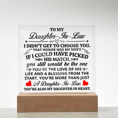 Clear acrylic plaque with a heartfelt message to a daughter-in-law, illuminated by an LED light base, symbolizing love and appreciation.
