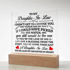 Clear acrylic plaque with a heartfelt message for a daughter-in-law, featuring black and red text and a wooden light-up base, perfect as a sentimental gift.