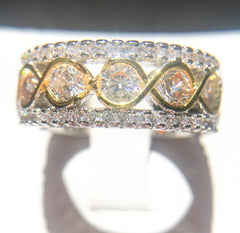 Wide two-tone gold and silver anniversary band ring featuring round cut cubic zirconia stones in a multi-row, stackable design for women’s jewelry.
