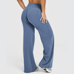 Woman wearing blue high-waisted straight leg yoga pants with a buttery soft fabric, shown from the back highlighting the comfortable fit and lounge style.