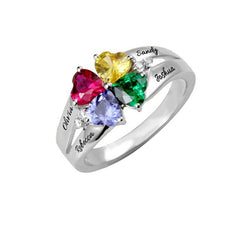 Silver personalized ring with four heart-shaped multicolor birthstones, each engraved with a different name, designed as a meaningful family gift for Mother's Day.