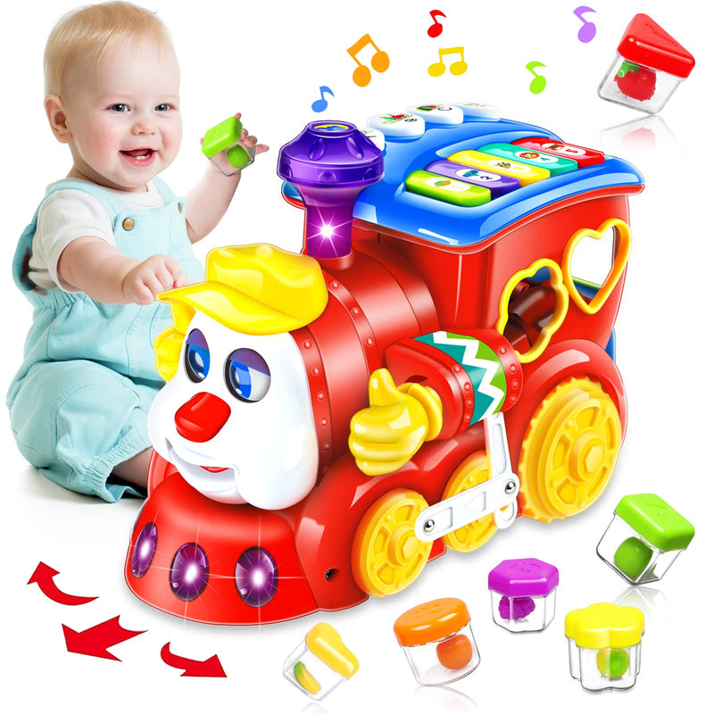 Toddler playing with a colorful, interactive music-playing train toy featuring shape sorters, buttons, and lights designed to encourage motor skill development and crawling.