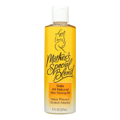 Clear bottle of natural skin toning oil labeled "Mother's Special Blend" with yellow-orange liquid, promoting safe, all-natural care to help prevent stretch marks.